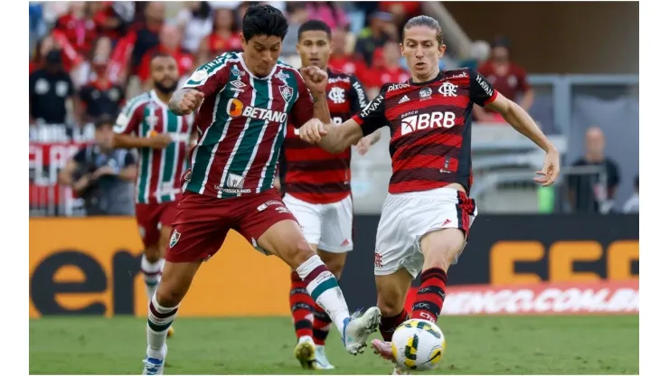 German Cano of Fluminense competes for the ball with Filipe Luis of Flamengo
