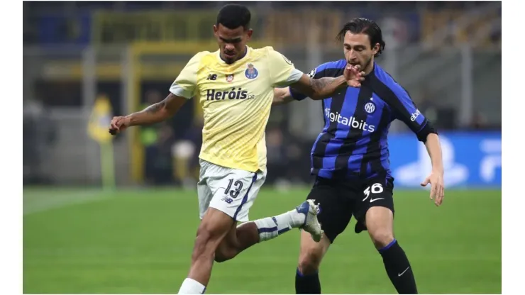 Galeno of FC Porto battles for possession with Matteo Darmian of FC Internazionale
