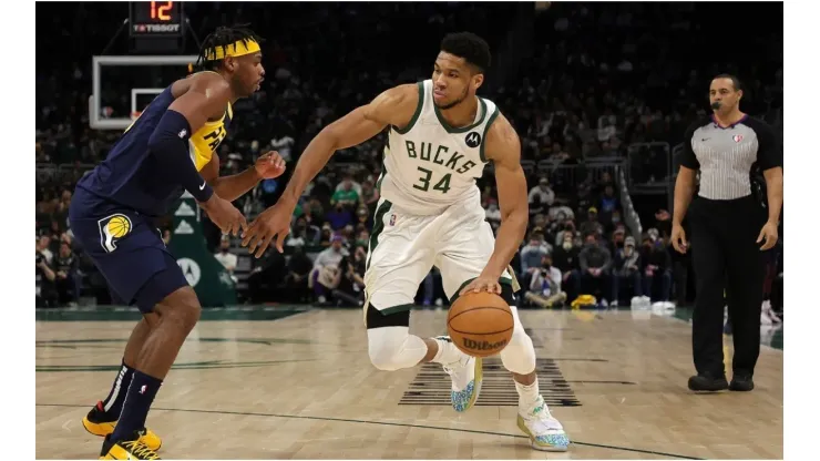 Giannis Antetokounmpo #34 of the Milwaukee Bucks is defended by Buddy Hield #24 of the Indiana Pacers
