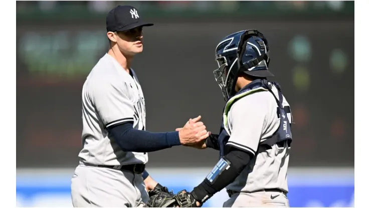 Clay Holmes #35 of the New York Yankees celebrates with Jose Trevino
