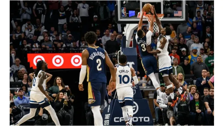 Anthony Edwards #1 of the Minnesota Timberwolves blocks a shot by CJ McCollum #3 of the New Orleans Pelicans
