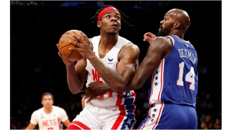 Day'Ron Sharpe #20 of the Brooklyn Nets goes to the basket as Dewayne Dedmon #14 of the Philadelphia 76ers defends
