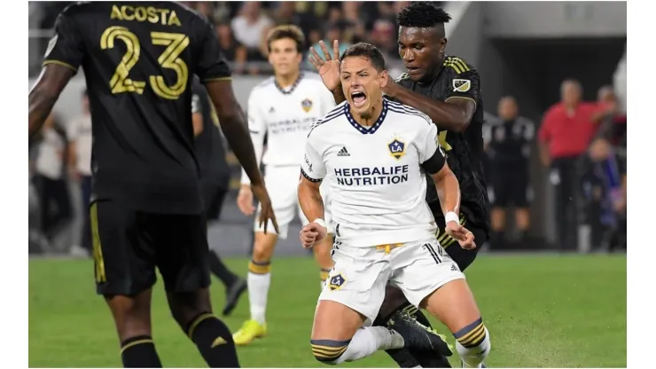 Javier Hernandez #14 of Los Angeles Galaxy is fouled by Jose Cifuentes #20 of Los Angeles FC
