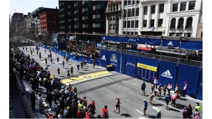 Runnings make their way down Boylston street to the finish line during the 126th Boston Marathon
