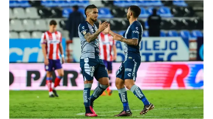 Cristian Arango (L) of Pachuca celebrates with Luis Chávez (R)
