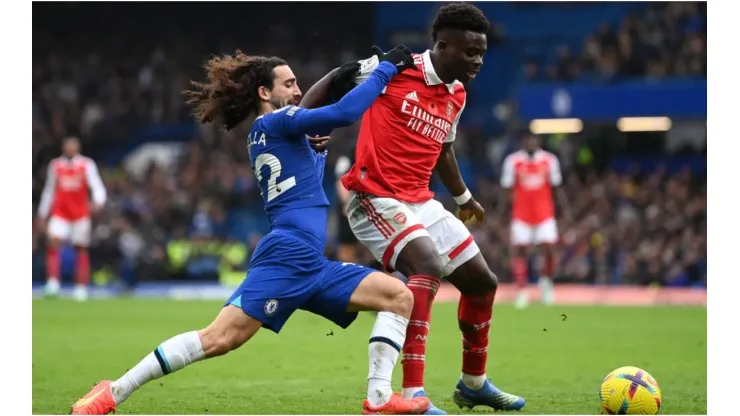 Bukayo Saka of Arsenal holds off Marc Cucurella of Chelsea
