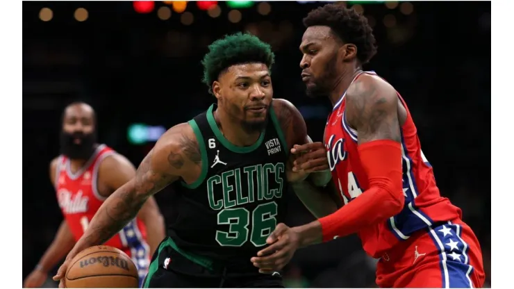 Marcus Smart #36 of the Boston Celtics dribbles against Paul Reed #44 of the Philadelphia 76ers
