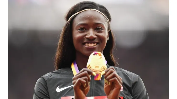 Tori Bowie poses with the gold medal for the Women's 100 meters at IAAF World Athletics Championships London 2017
