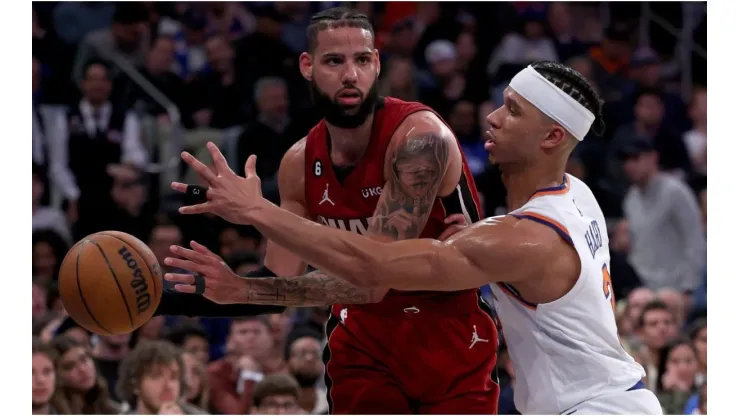 Caleb Martin #16 of the Miami Heat tries to pass as Josh Hart #3 of the New York Knicks
