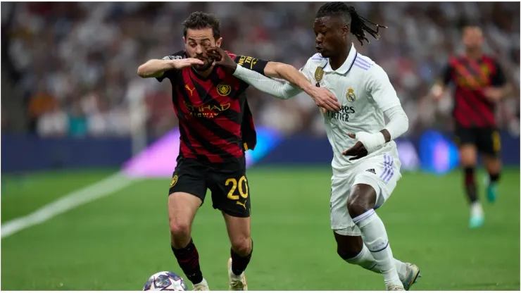 Bernardo Silva of Manchester City is challenged by Eduardo Camavinga of Real Madrid
