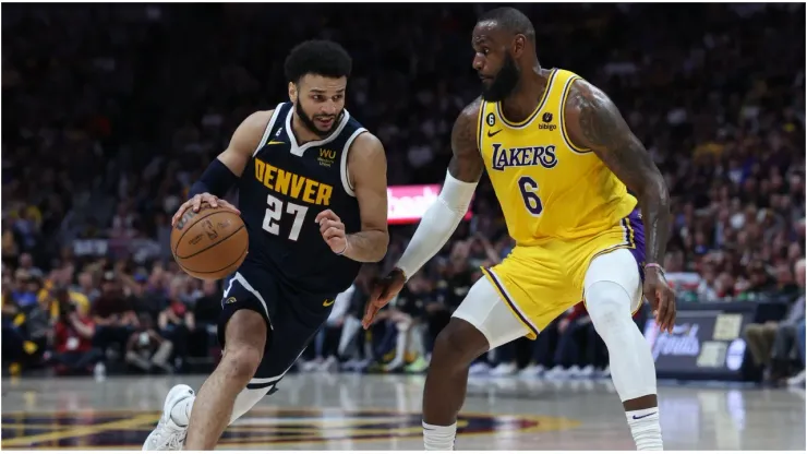 Jamal Murray #27 of the Denver Nuggets drives against LeBron James #6 of the Los Angeles Lakers
