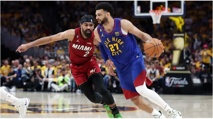 Jamal Murray #27 of the Denver Nuggets drives against Gabe Vincent #2 of the Miami Heat
