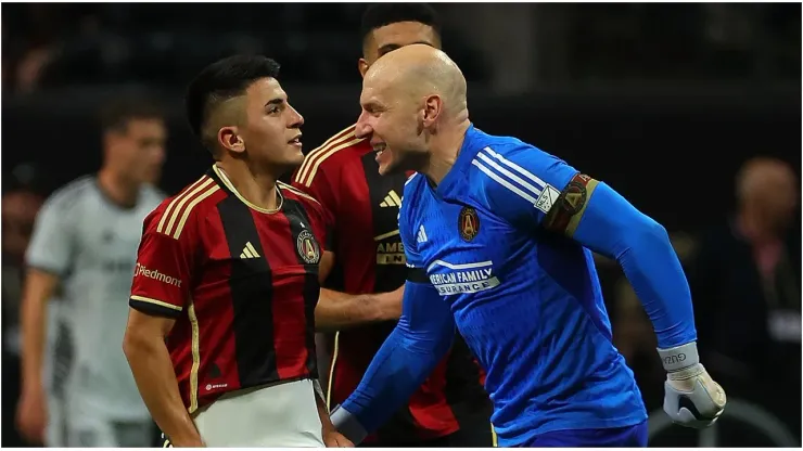 Thiago Almada #23 of Atlanta United reacts with goalkeeper Brad Guzan
