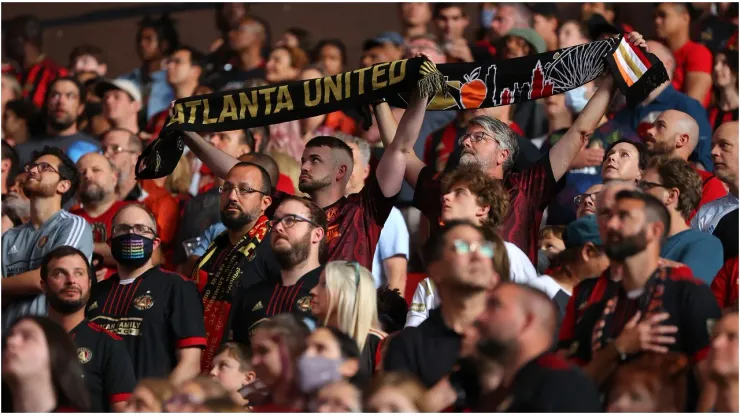 Fans stand prior to the match
