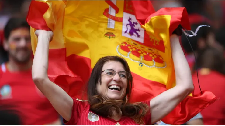 A fan of Spain waves a flag
