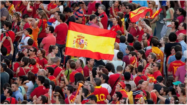 Spain fans fly the national flag
