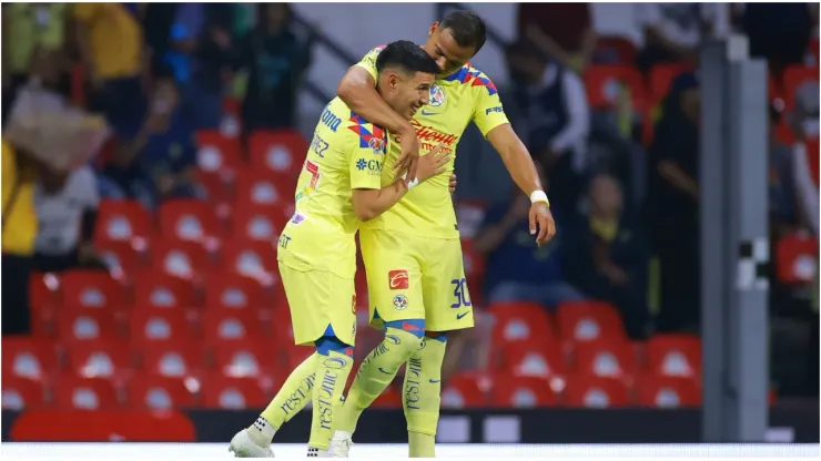 Leonardo Suarez of America celebrates with Roman Martinez of America
