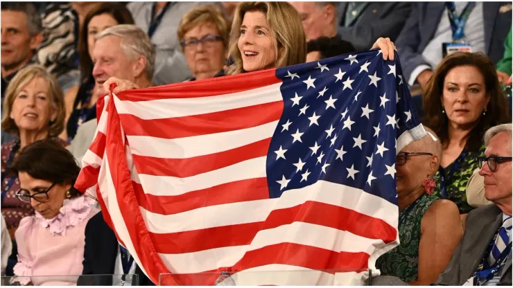 United States fan holds flag
