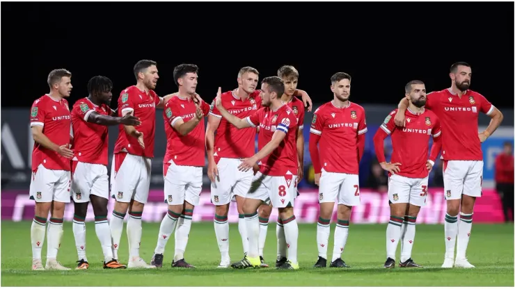 Luke Young of Wrexham celebrates with team mates
