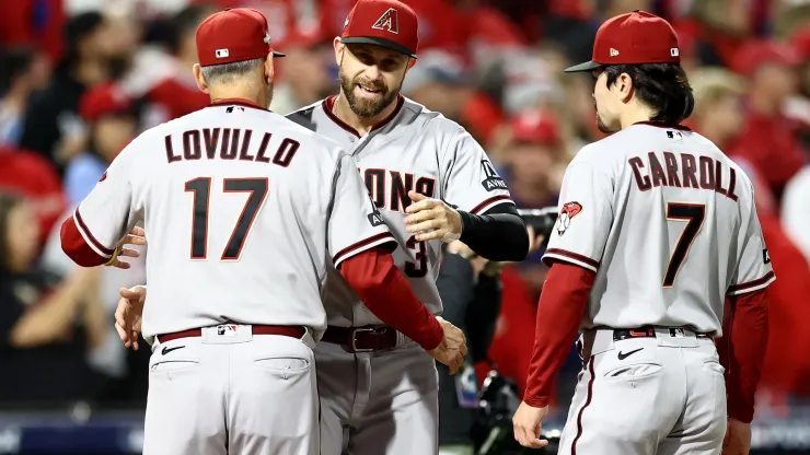 Manager Torey Lovullo #17 greets Evan Longoria #3 of the Arizona Diamondbacks
