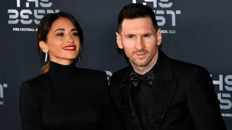 Antonela Roccuzzo and Lionel Messi pose for a photo on the Green Carpet ahead of The Best FIFA Football Awards 2022 on February 27, 2023 in Paris, France.
