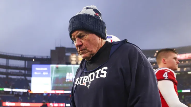 Head coach Bill Belichick of the New England Patriots walks off the field after losing to the Los Angeles Chargers 6-0 at Gillette Stadium on December 03, 2023 in Foxborough, Massachusetts.
