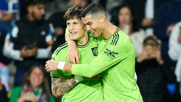 Alejandro Garnacho celebrates with Cristiano Ronaldo after scoring a goal for Manchester United.
