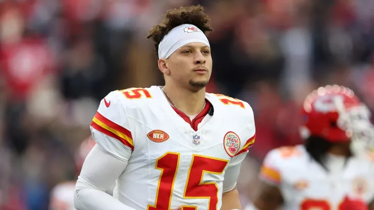 Patrick Mahomes looks on before a game
