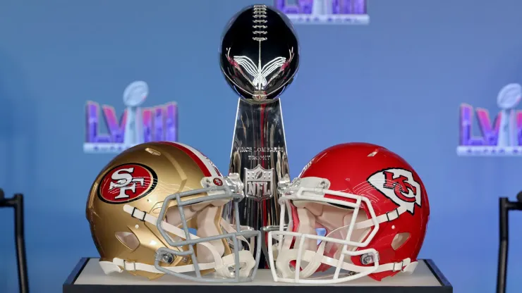 The Vince Lombardi trophy with a San Francisco 49ers and Kansas City Chiefs helmet for Super Bowl LVIII
