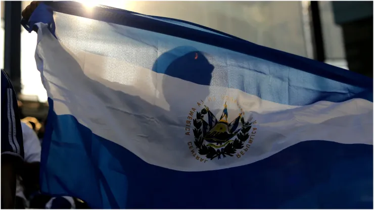 El Salvador fan waves a flag
