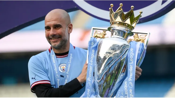 Guardiola with the Premier League trophy
