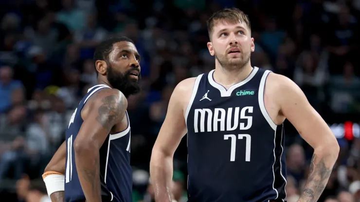 Kyrie Irving #11 and Luka Doncic #77 of the Dallas Mavericks react during the fourth quarter in Game Four of the Western Conference Second Round Playoffs at American Airlines Center on May 13, 2024 in Dallas, Texas.
