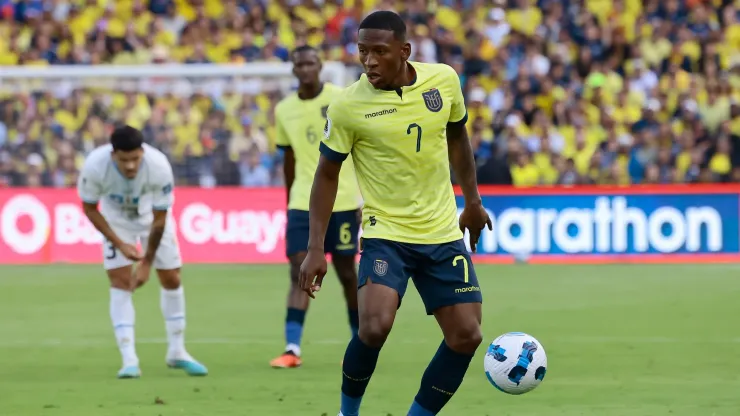 Pervis Estupiñan of Ecuador controls the ball during a FIFA World Cup 2026 Qualifier match between Ecuador and Uruguay.
