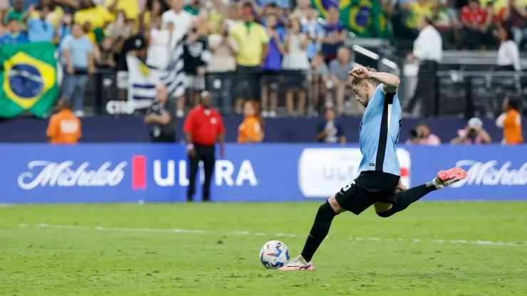 Federico Valverde of Uruguay scores the team's first penalty in the penalty shoot out during the CONMEBOL Copa America 2024 quarter-final match between Uruguay and Brazil.
