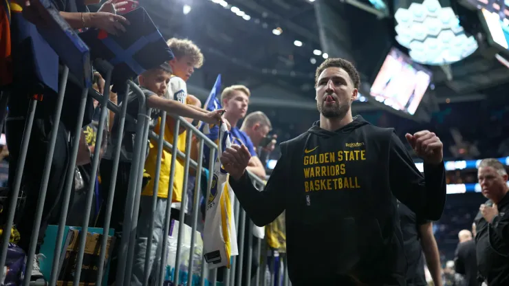 Klay Thompson #11 of the Golden State Warriors leaves the court after warming up prior to the game against the Charlotte Hornets at Spectrum Center on March 29, 2024 in Charlotte, North Carolina.
