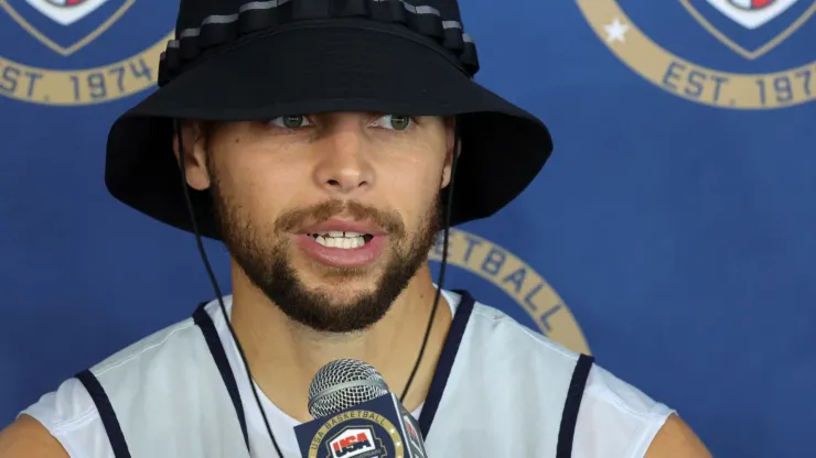 Stephen Curry #4 of the 2024 USA Basketball Men's National Team talks to members of the media after a practice session during the team's training camp.
