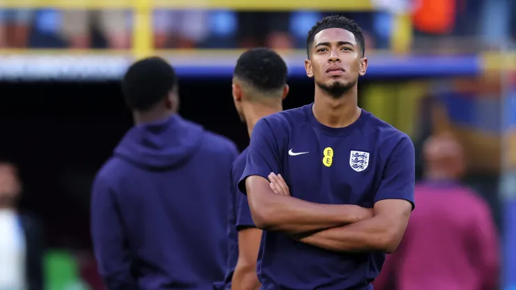 Jude Bellingham of England looks on as he inspects the pitch prior to the UEFA EURO 2024 semi-final match between Netherlands and England at Football Stadium Dortmund.
