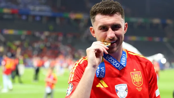 Aymeric Laporte of Spain bites his winners medal after victory over England in the UEFA EURO 2024 final match between Spain and England at Olympiastadion on July 14, 2024 in Berlin, Germany. 
