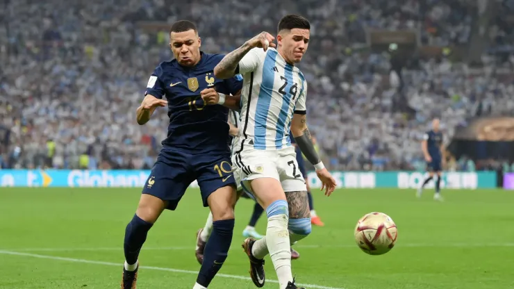 Kylian Mbappe of France battles for possession with Enzo Fernandez of Argentina during the FIFA World Cup Qatar 2022 Final.
