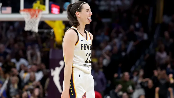 Caitlin Clark #22 of the Indiana Fever reacts to a three point basket during the fourth quarter against the Los Angeles Sparks at Crypto.com Arena on May 24, 2024 in Los Angeles, California. 
