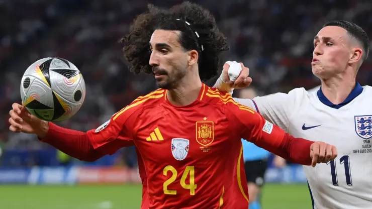 Marc Cucurella of Spain attempts to control the ball whilst under pressure from Phil Foden of England during the UEFA EURO 2024 final match between Spain and England at Olympiastadion on July 14, 2024 in Berlin, Germany.
