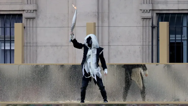 Masked man at the Paris 2024 Olympics opening ceremony
