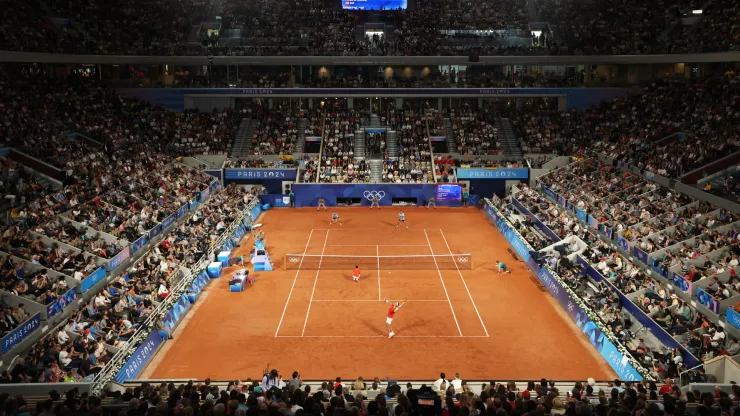 A general view as Rafael Nadal serves with partner Carlos Alcaraz of Team Spain against Andres Molteni and Maximo Gonzalez of Team Argentina during the Men's Doubles first round match on day one of the Olympic Games Paris 2024
