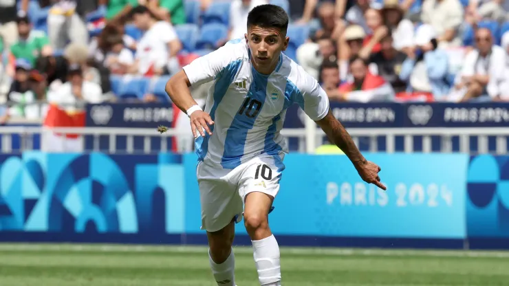 Thiago Almada #10 of Team Argentina runs with the ball during the Men's group B match between Argentina and Iraq during the Olympic Games Paris 2024.
