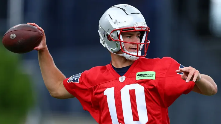 Drake Maye #10 of the New England Patriots throws the ball during the New England Patriots OTA Offseason Workout on May 29, 2024 in Foxborough, Massachusetts.
