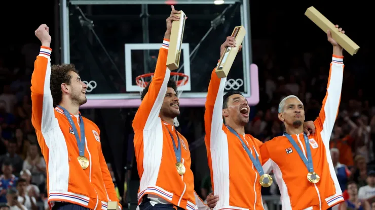 Men's 3×3 basketball Gold medalists Jan Driessen, Dimeo van der Horst, Arvin Slagter, and Worthy de Jong of Team Netherlands celebrate during the medal ceremony for Men's 3×3 basketball.
