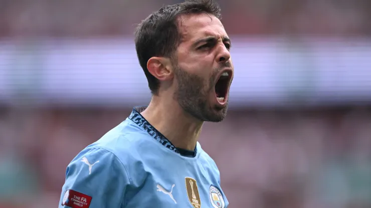 Bernardo Silva of Manchester City celebrates scoring his team's first goal during the 2024 FA Community Shield match between Manchester United and Manchester City at Wembley Stadium on August 10, 2024 in London, England.
