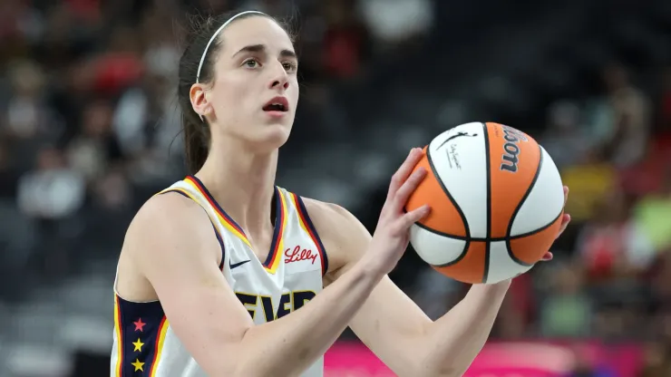 Caitlin Clark #22 of the Indiana Fever shoots a free throw against the Las Vegas Aces
