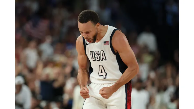 Stephen Curry #4 of Team United States reacts after a basket during a Men's basketball semifinals match between Team United States and Team Serbia on day thirteen of the Olympic Games Paris 2024 at Bercy Arena on August 08, 2024 in Paris, France.
