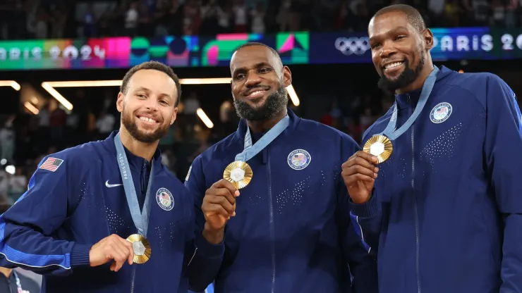 Stephen Curry, LeBron James, and Kevin Durant of Team United States pose for a photo during the Men's basketball medal ceremony on day fifteen of the Olympic Games Paris 2024 at Bercy Arena on August 10, 2024 in Paris, France.
